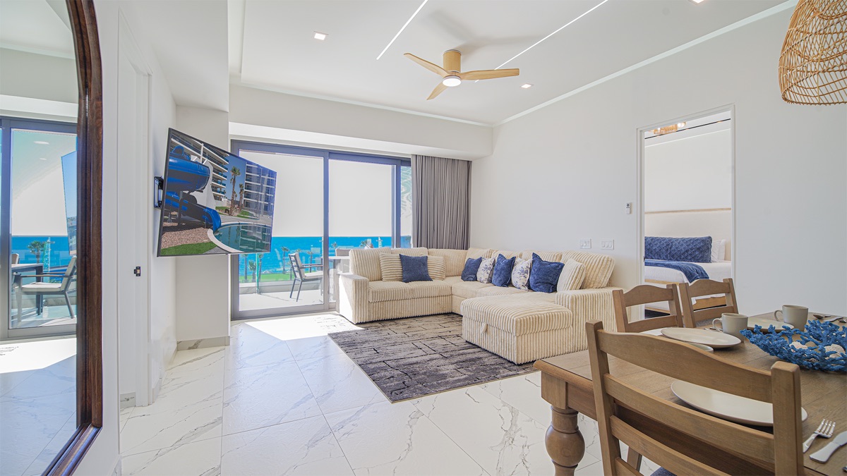Living room opening to the balcony and ocean